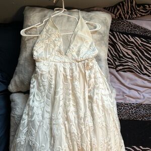 White lacy dress from Hello Molly. This is a backless dress with slit on leg